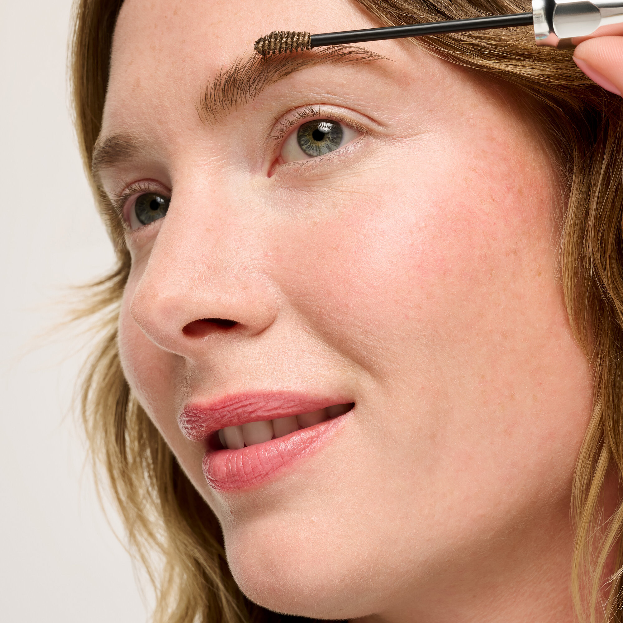 Model using Precisely My Brow Wax