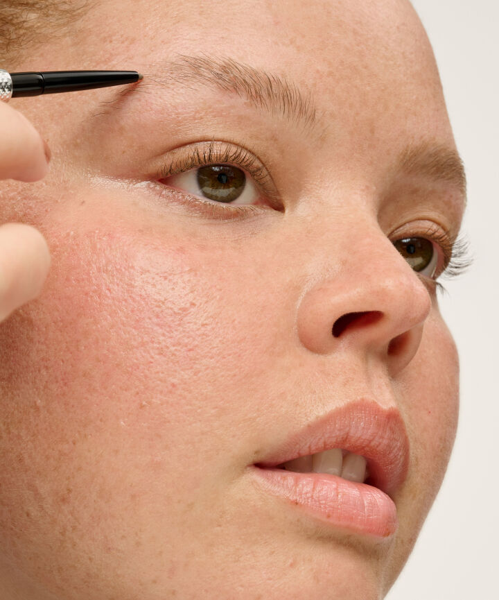 Close up of model having brows done