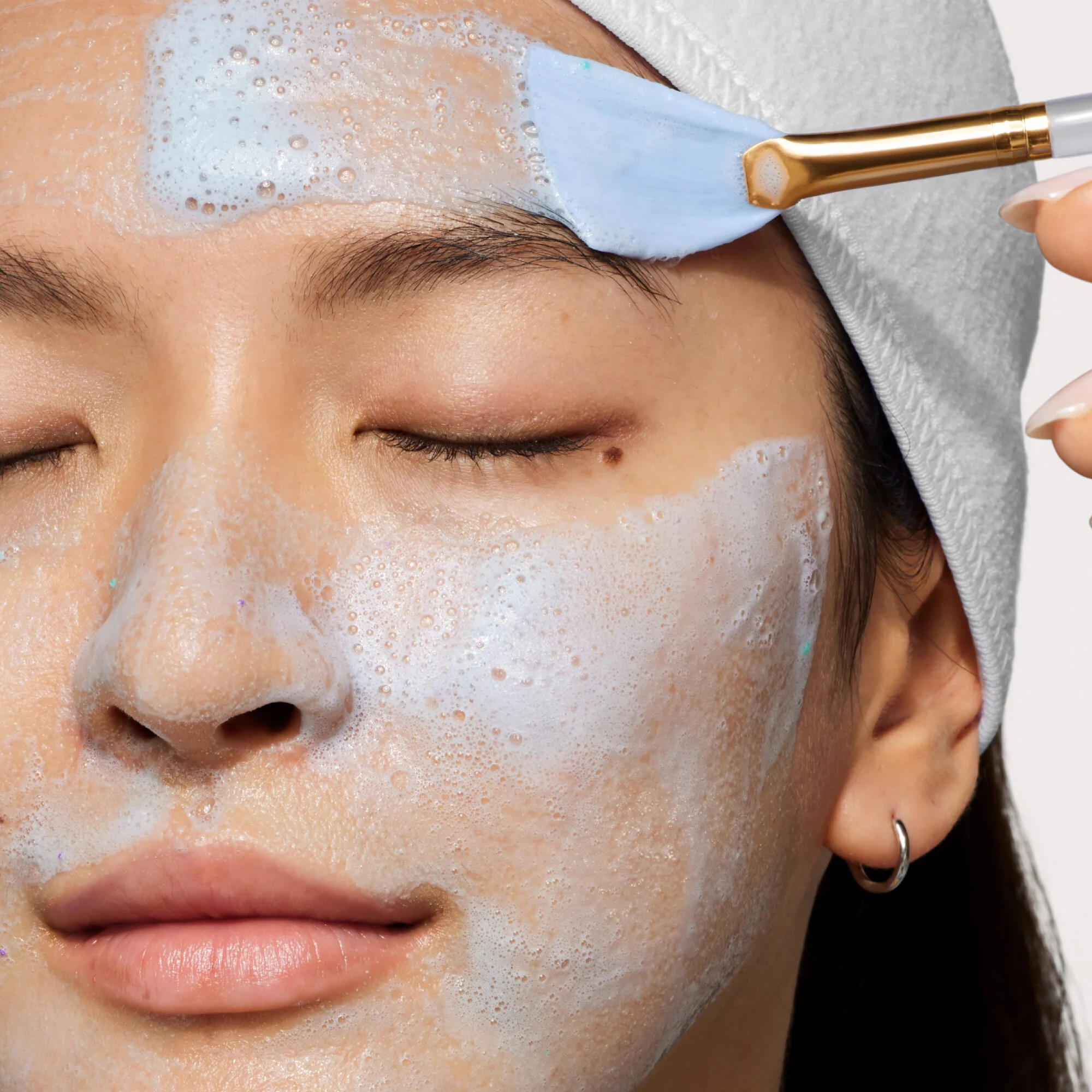 Model being applied Wow Polish on her face