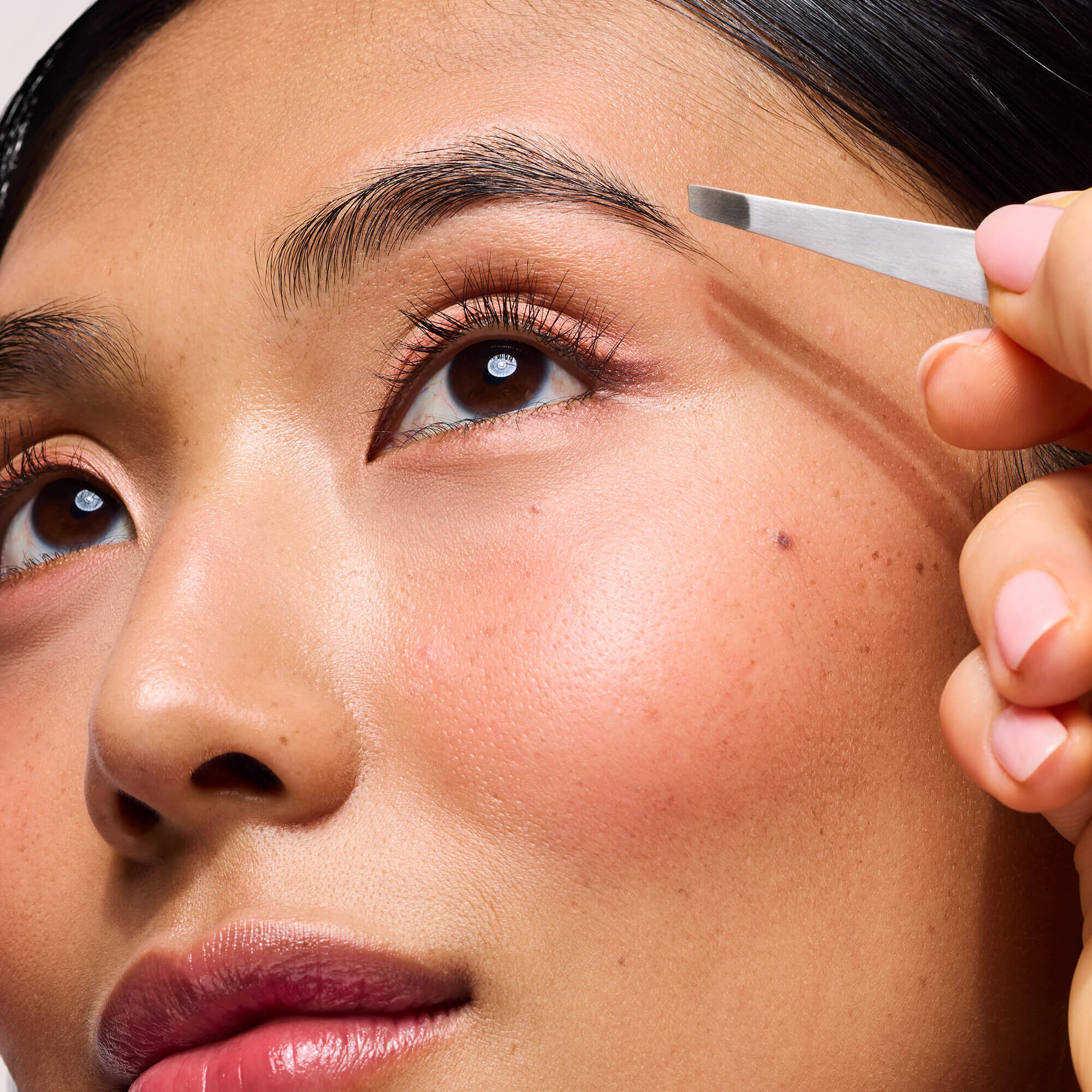 Pull in the direction of hair growth.