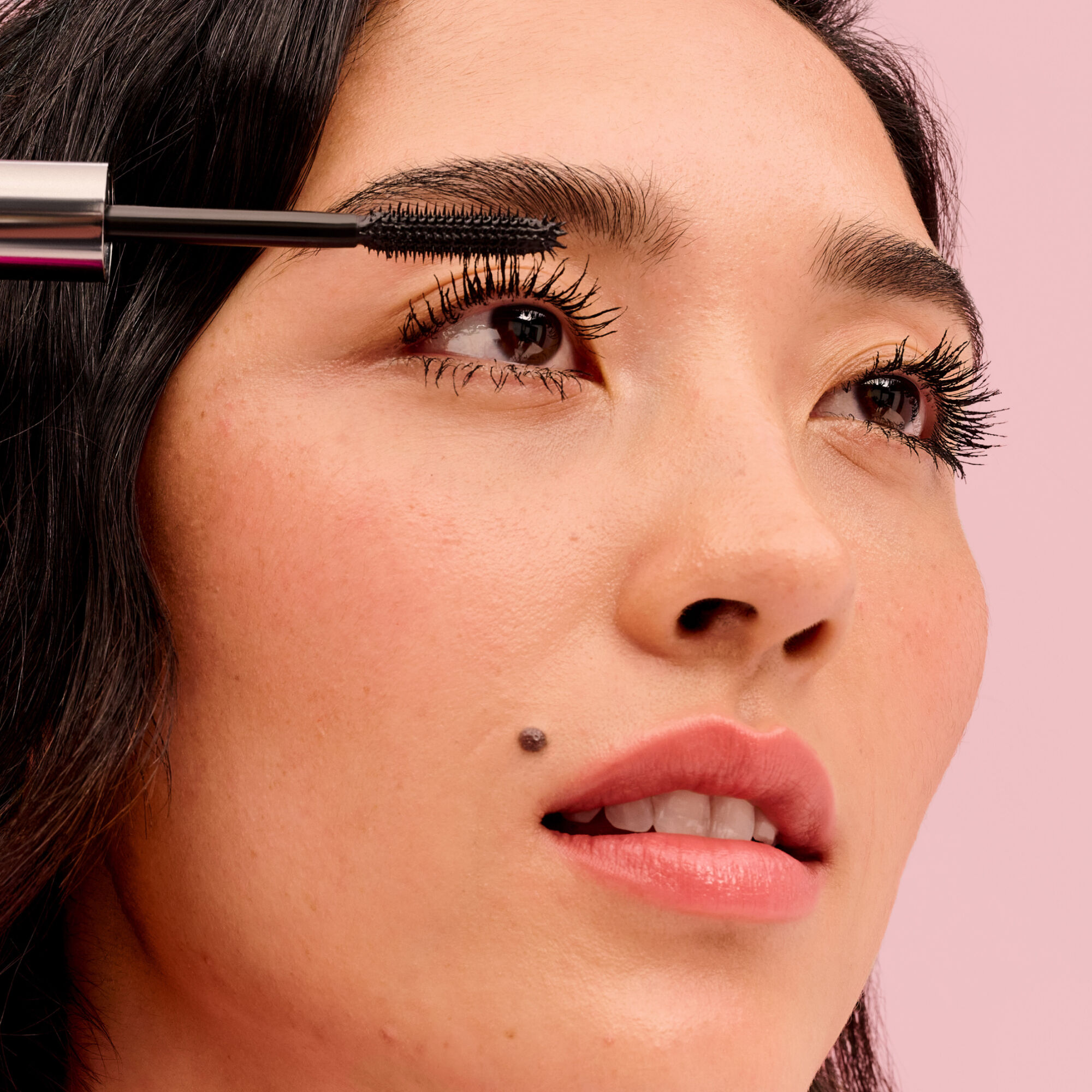 Model applying They're Real! Mascara