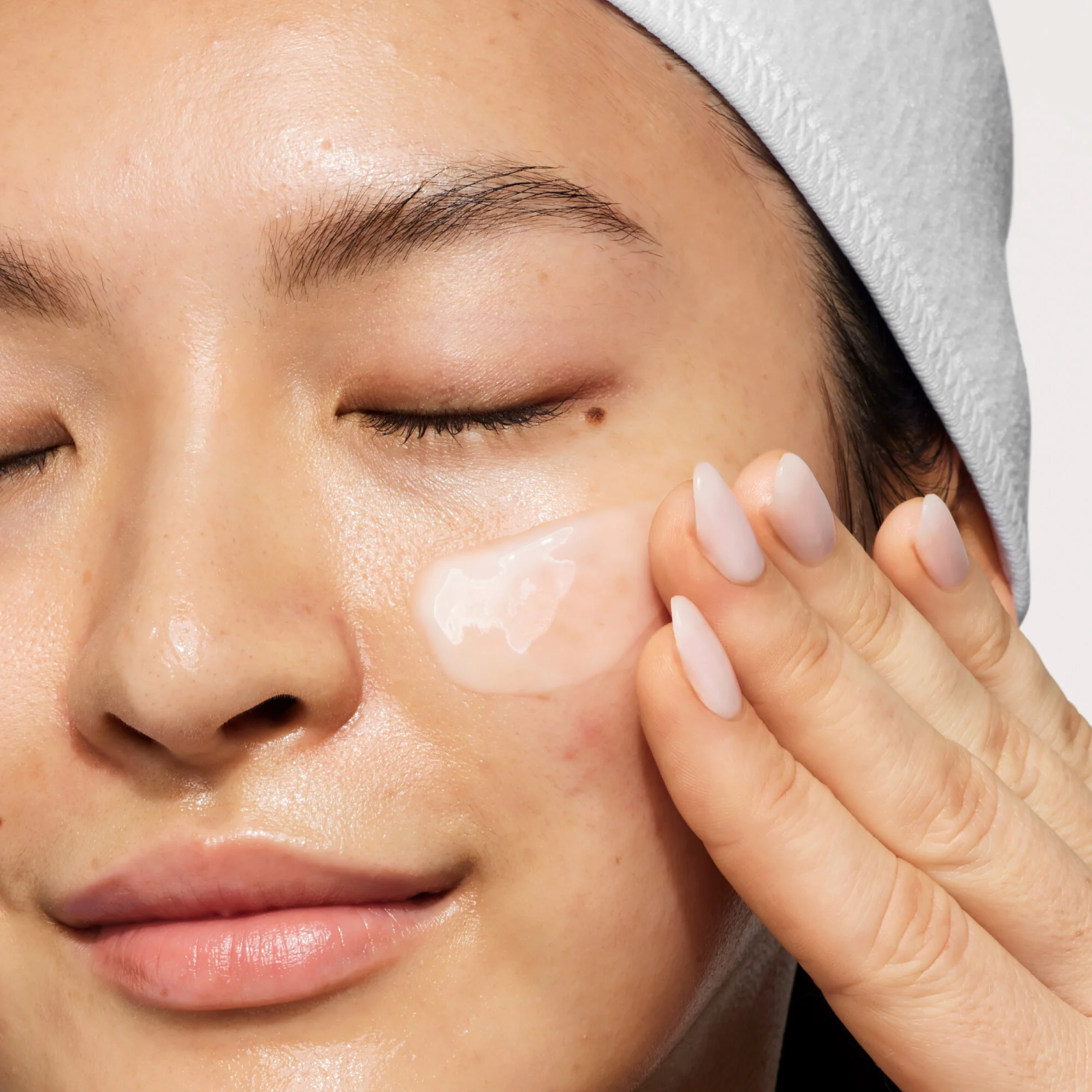 Model with Tight n Toned toner on face