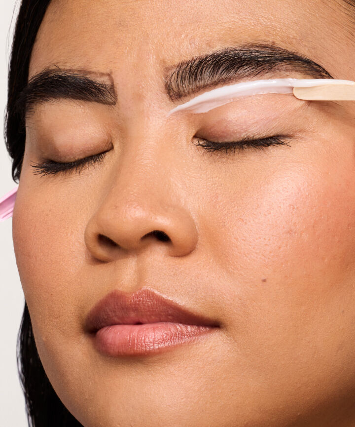 Close up of model having brows done