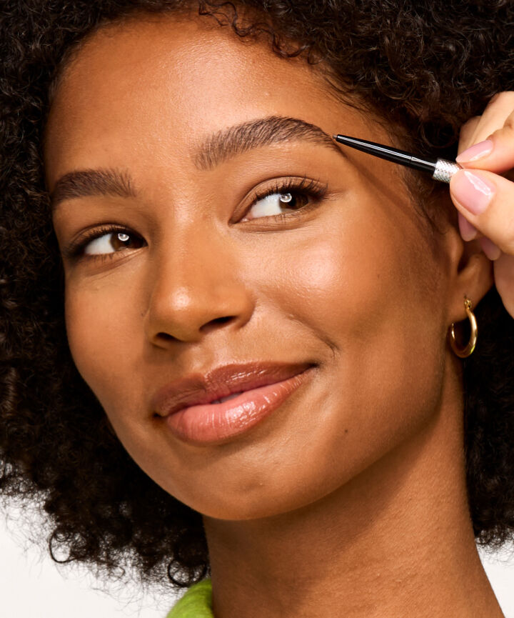 Model applying Precisely, My Brow Pencil