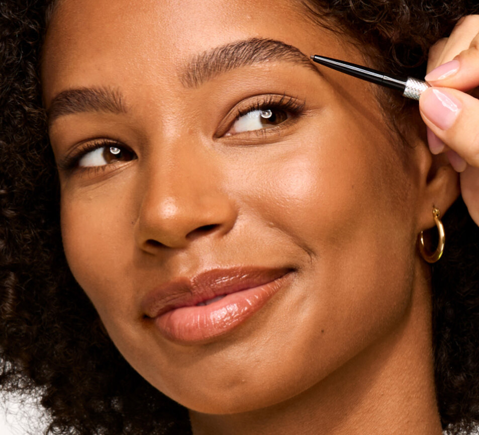 Model applying Precisely, My Brow Pencil